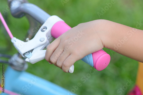 Hand holding bicycle brake