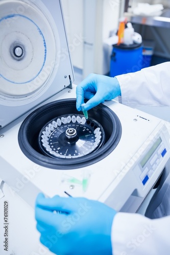 Tableau sur toile Close up of a chemist using a centrifuge
