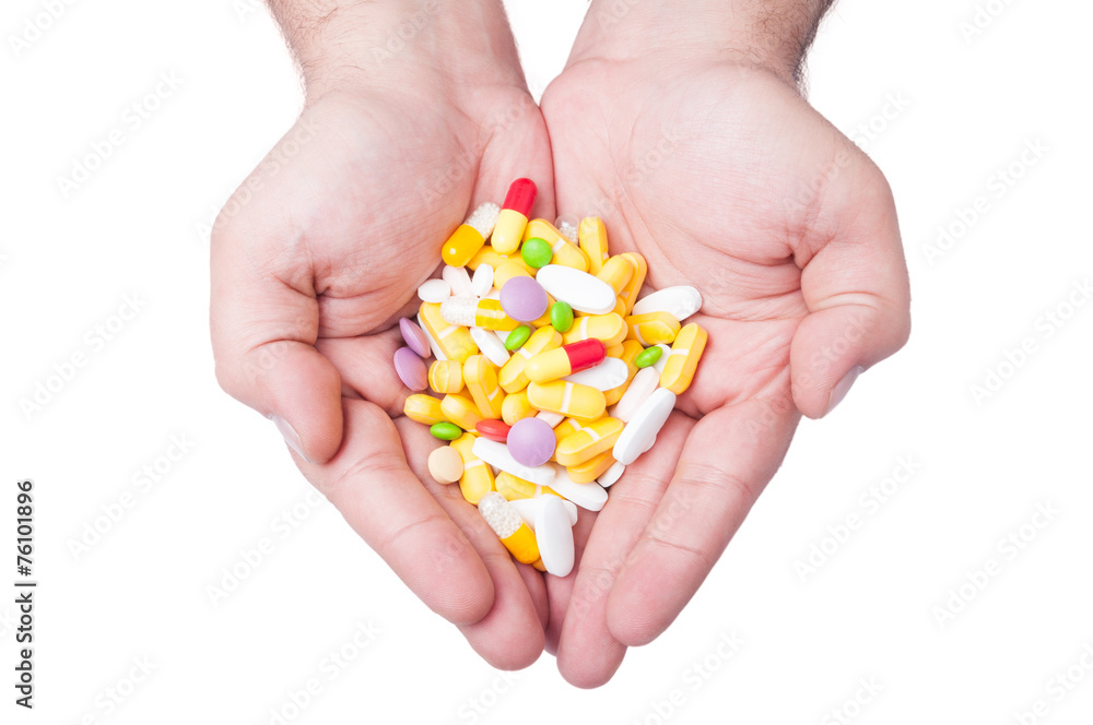 Two hands holding pills Two hands holding pills
