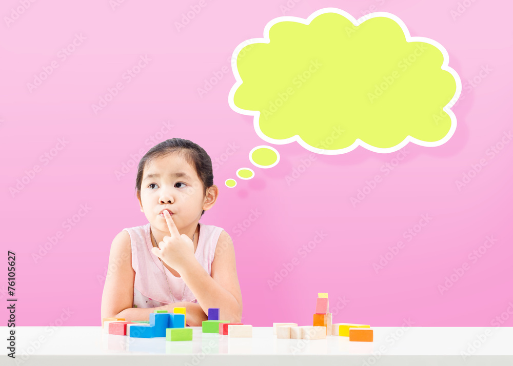Thinking little girl with empty bubble and wooden building block Thinking little girl with empty bubble and wooden building block