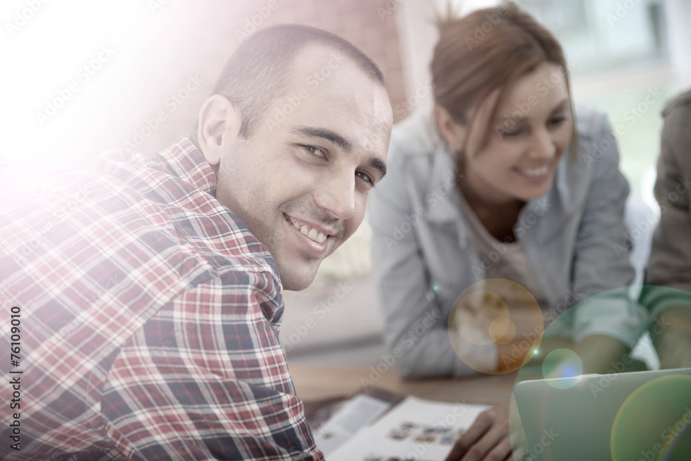 Smiling guy in shared apartment with roommates Smiling guy in shared apartment with roommates