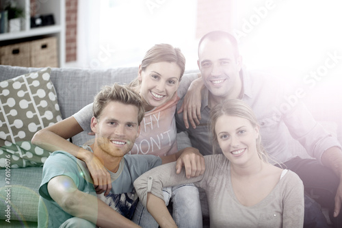 Roommates sitting together in couch