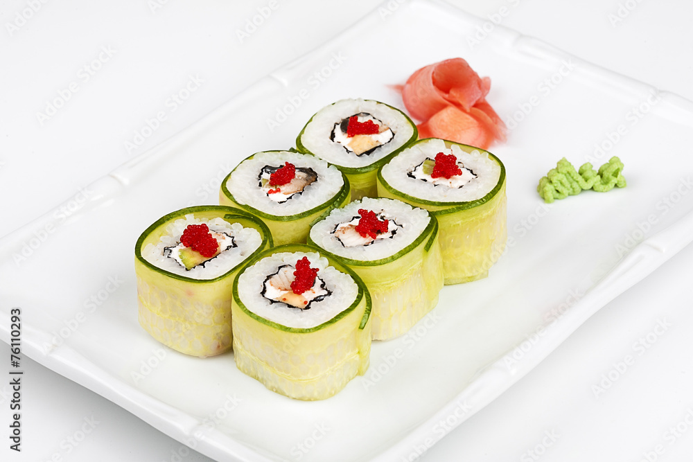 Sushi roll with avocado, cucumber and caviar. Sushi roll with avocado, cucumber and caviar.