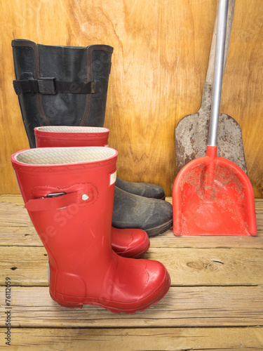 mans and boys red rubber boots with spades photo