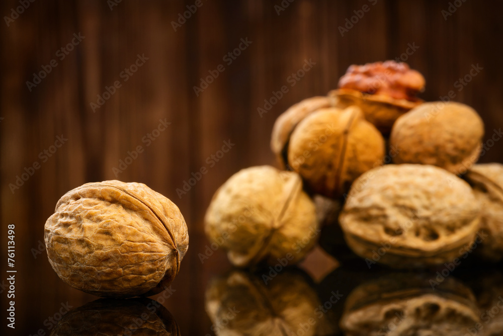 Walnuts on old wooden background Walnuts on old wooden background