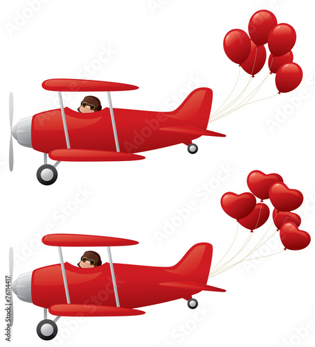 Red biplanes towing balloons.