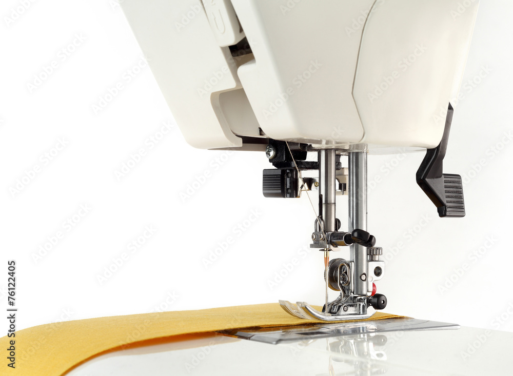 Sewing machine and fabric on a white background.