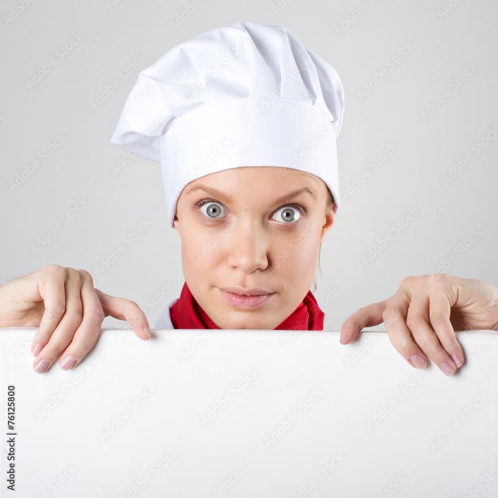 Female chef holding a poster for text Female chef holding a poster for text