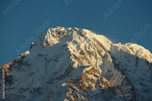 Mountain peak Annapurna South At Sunrise In Himalayas