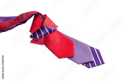 men's ties knotted on a white background