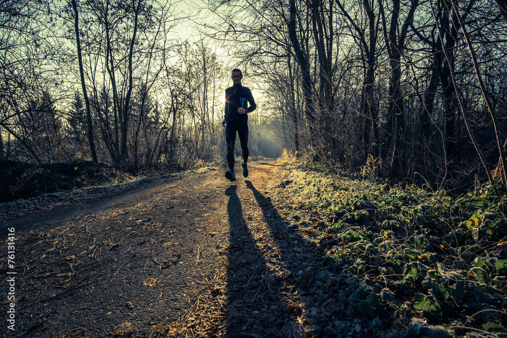 a man trail running in the country