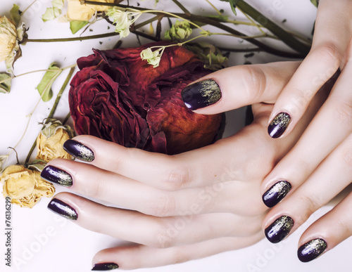 close up picture of manicure nails with dry flower red rose, deh photo