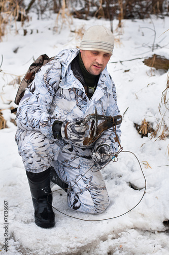 hunter with a trap in hands photo