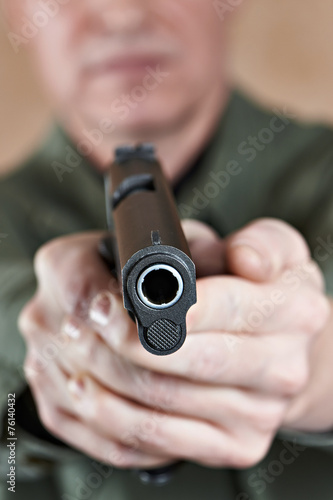 Soldier aiming a pistol Colt