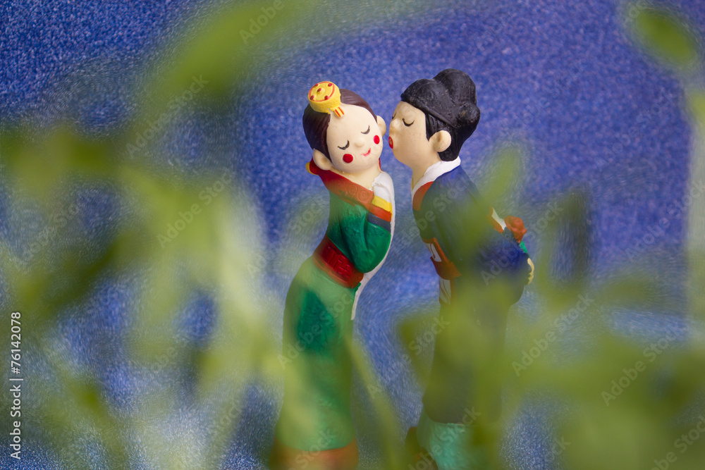 Fototapeta premium Couple doll on blue background.