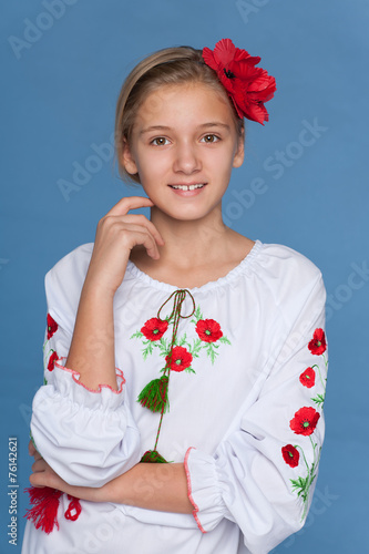 Ukrainian girl against the blue background