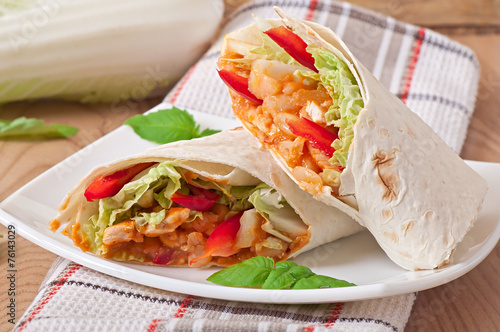 Burrito with chicken, beans, tomatoes and sweet peppers
