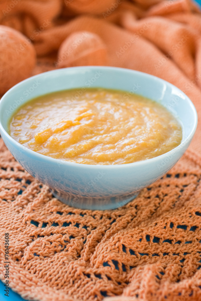 Dietary pumpkin porridge in the blue plate Dietary pumpkin porridge in the blue plate