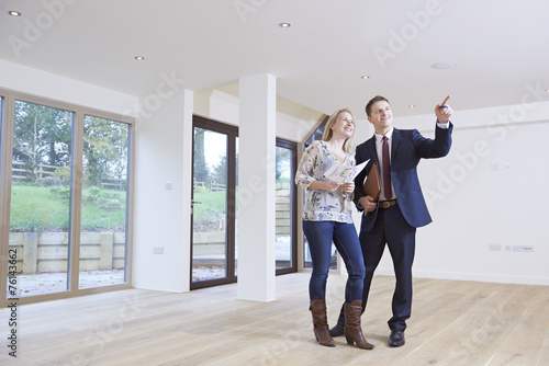 Estate Agent Showing Prospective Female Buyer Around Property photo