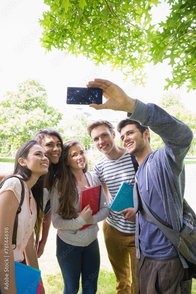 Fototapeta premium Happy students taking a selfie outside on campus
