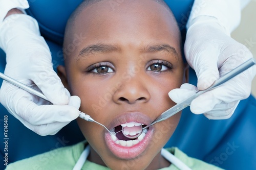 Close up of boy having his teeth examined