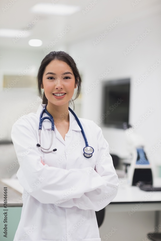 Pretty medical student smiling at camera Pretty medical student smiling at camera