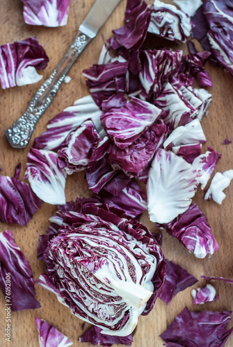 Sliced radicchio on wooden table. Selective focus. Vertical