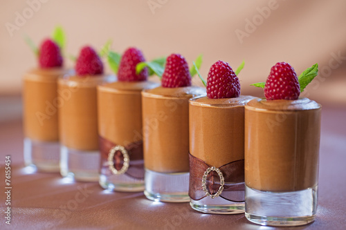 Group of glasses with chocolate mousse.