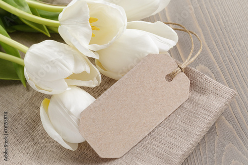 Fototapeta Naklejka Na Ścianę i Meble -  white tulips on rustic wood background