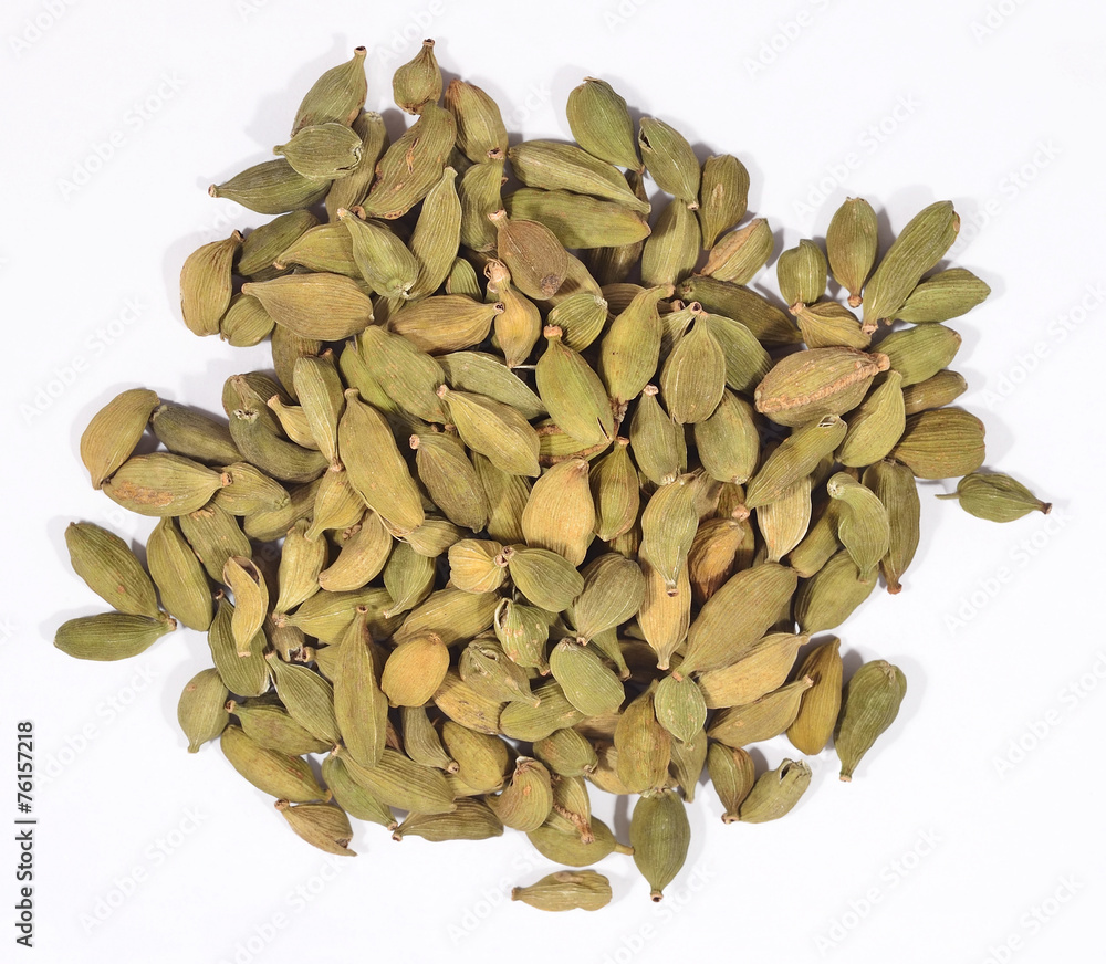 Heap of cardamom seeds on a white Heap of cardamom seeds on a white