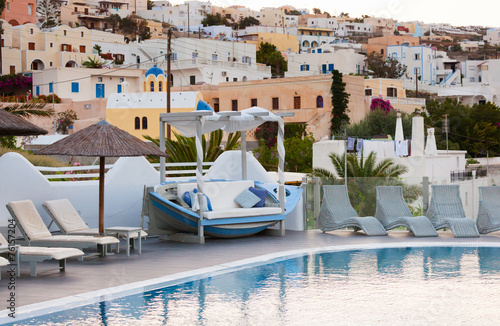 View of Fira town from a resort with swimming pool.