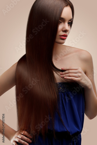 Hair. Portrait of Beautiful Woman with Long Brown Hair. High qua