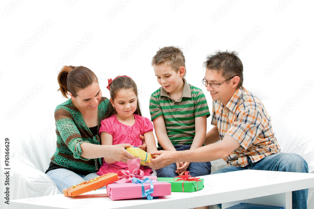 Happy cheering family in white room with presents Happy cheering family in white room with presents