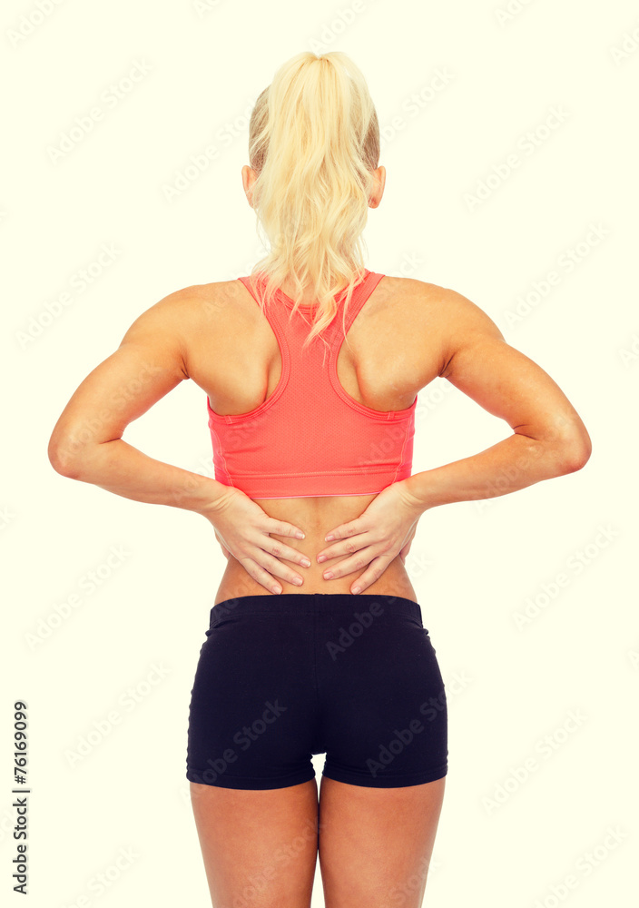 Fototapeta premium sporty woman touching her back