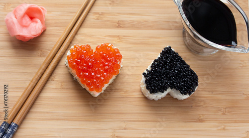 Two heart shaped sushi with salmon roe and beluga caviar
