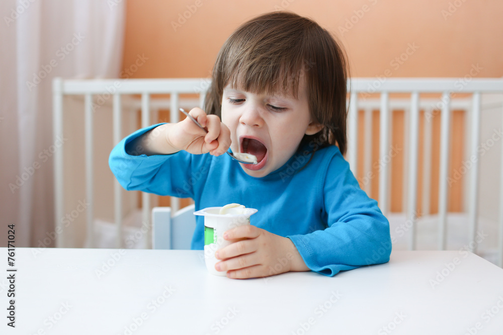 lovely little boy eats youghourt lovely little boy eats youghourt