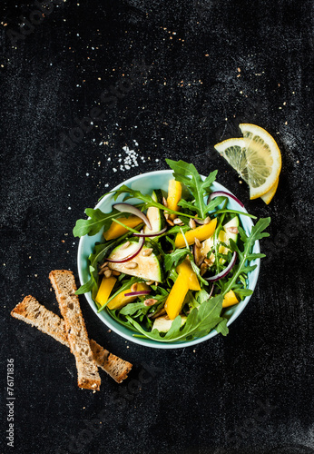 Fresh green spring salad (arugula, yellow pepper, zucchini)