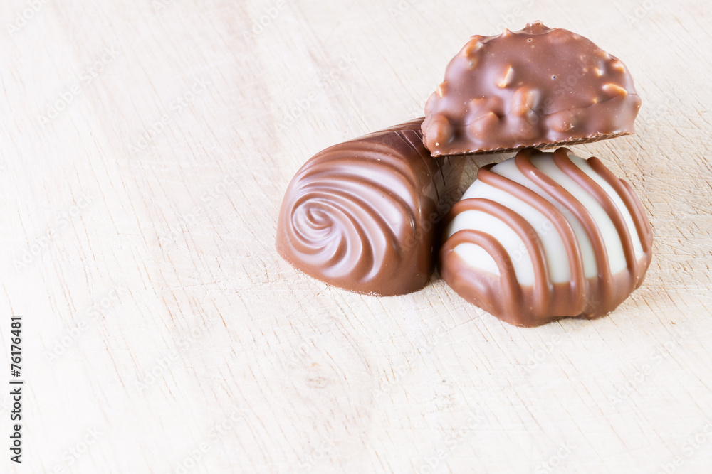 Chocolate pralines on wood Chocolate pralines on wood