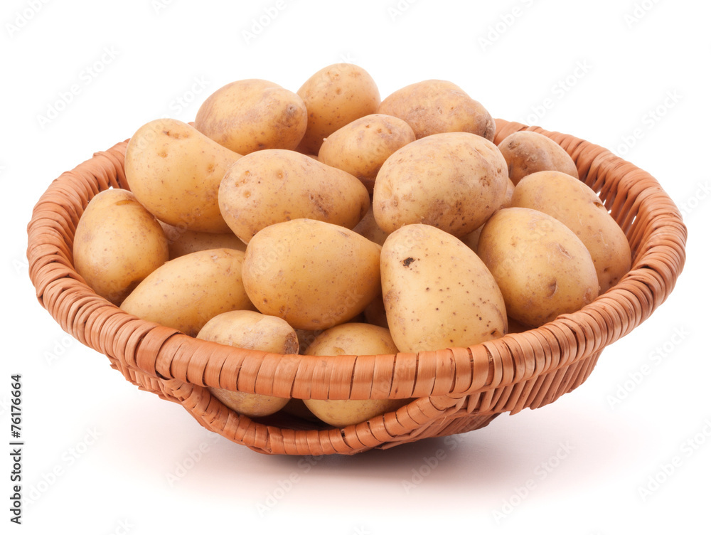 Potato tuber in wicker basket isolated on white background Potato tuber in wicker basket isolated on white background