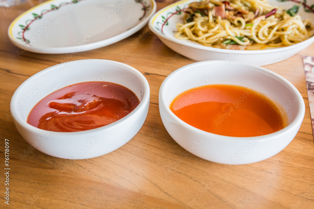 tomato sauce and hot chili sauce. tomato sauce and hot chili sauce.