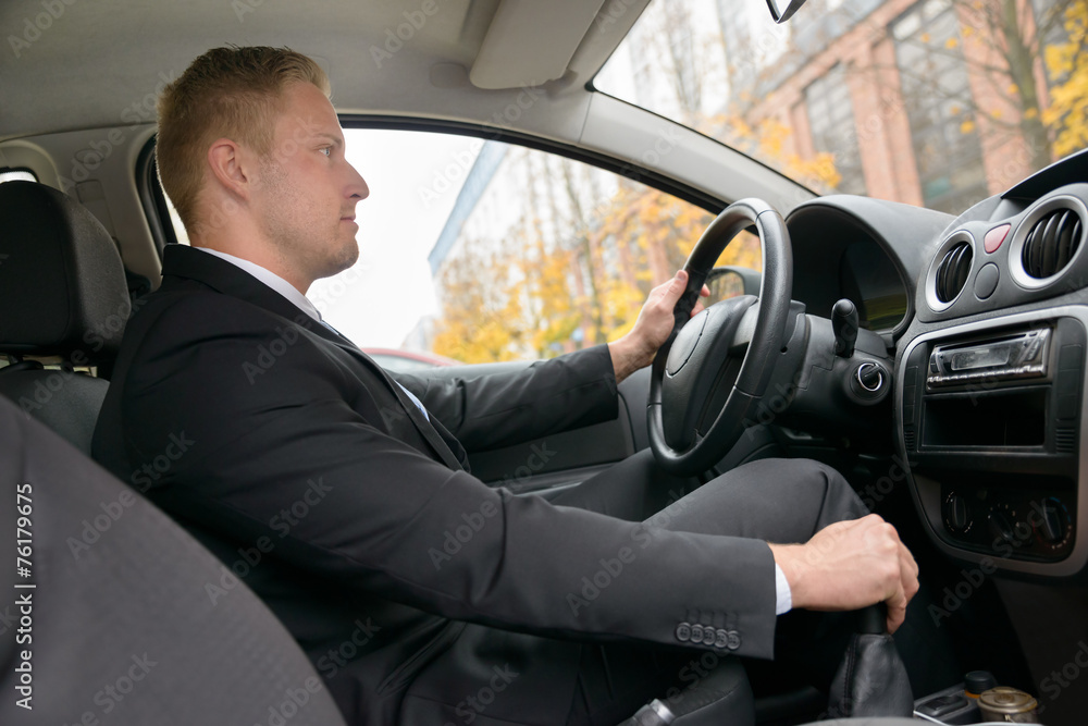 Young Man Driving Car