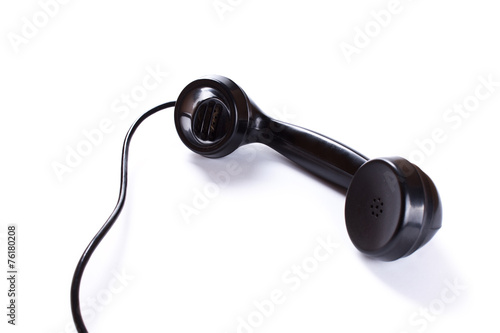 black telephone receiver on white background