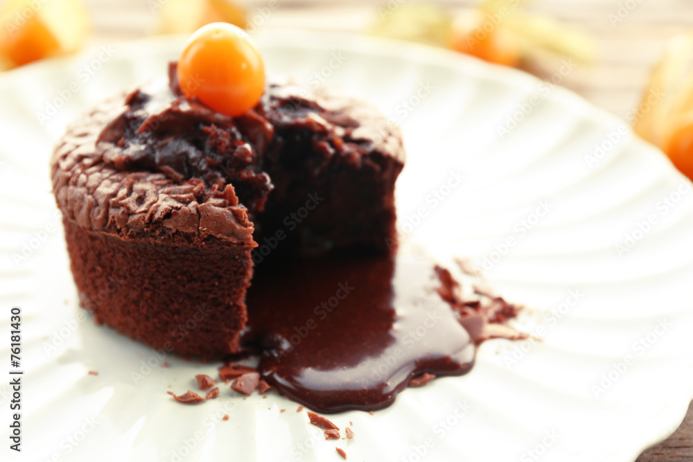 Hot chocolate pudding with fondant centre on plate, close-up Hot chocolate pudding with fondant centre on plate, close-up