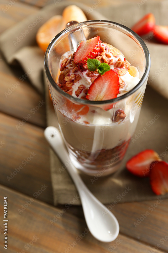 Healthy layered dessert with muesli and strawberries on table Healthy layered dessert with muesli and strawberries on table