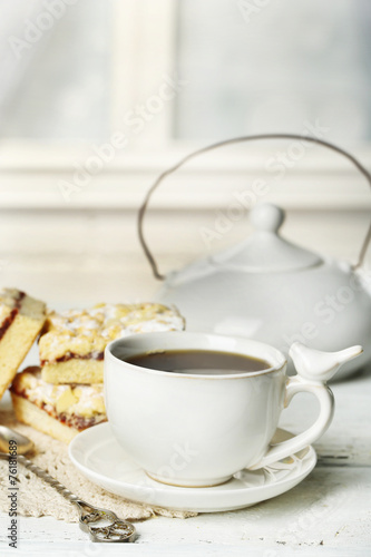 Fototapeta Naklejka Na Ścianę i Meble -  Cup of tea and tasty homemade pie on wooden table
