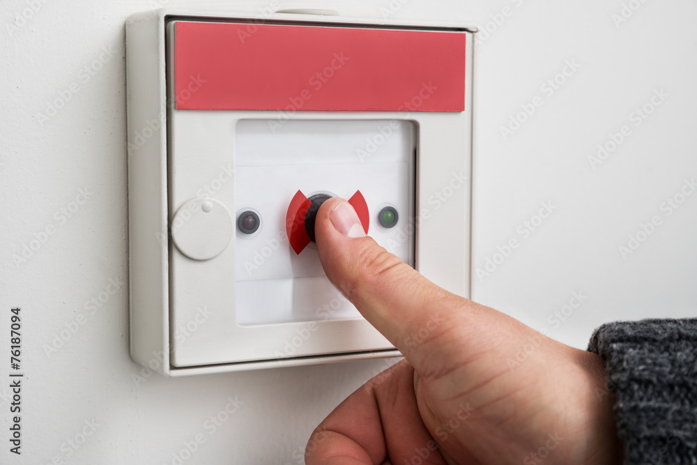 Man Pressing Emergency Button Man Pressing Emergency Button