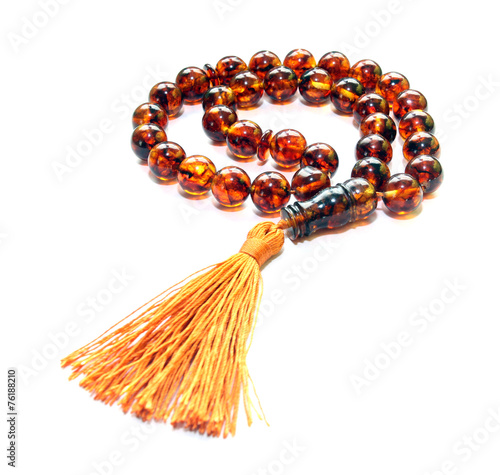Baltic amber islamic rosary isolated on white