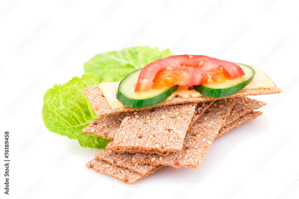 Crackers with fresh vegetables and cheese Crackers with fresh vegetables and cheese