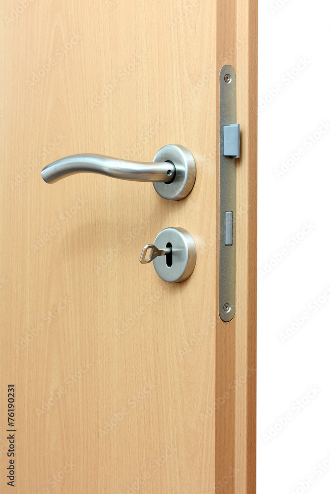 Modren style door handle on natural wooden door. Modren style door handle on natural wooden door.