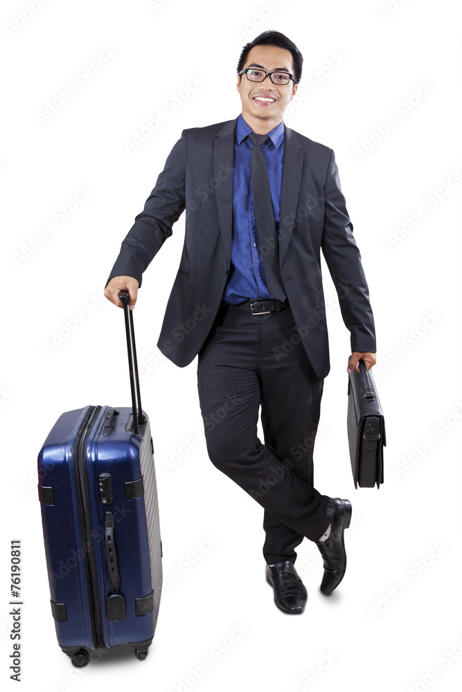 Male worker carrying luggage and briefcase Male worker carrying luggage and briefcase